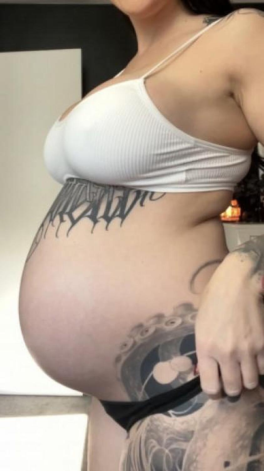 Pregnant Belly Rubbing With Lotion