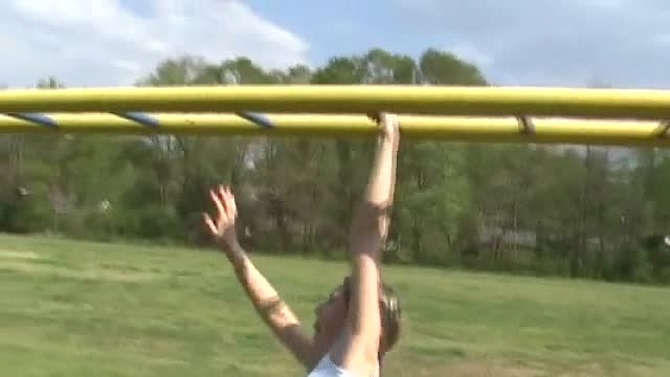 Kitty in the Play Ground on the Monkey Bars