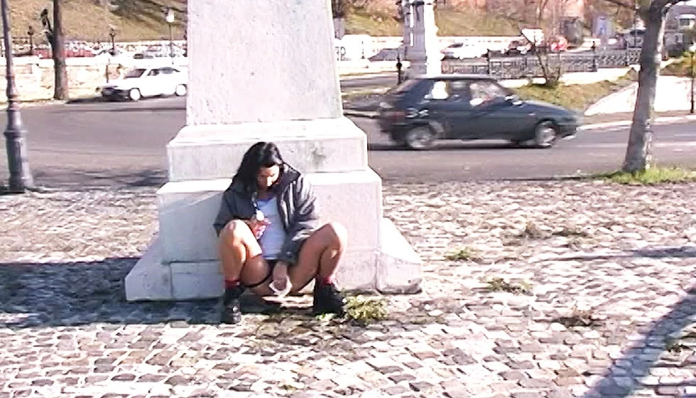 Girl Pees Behind Monument