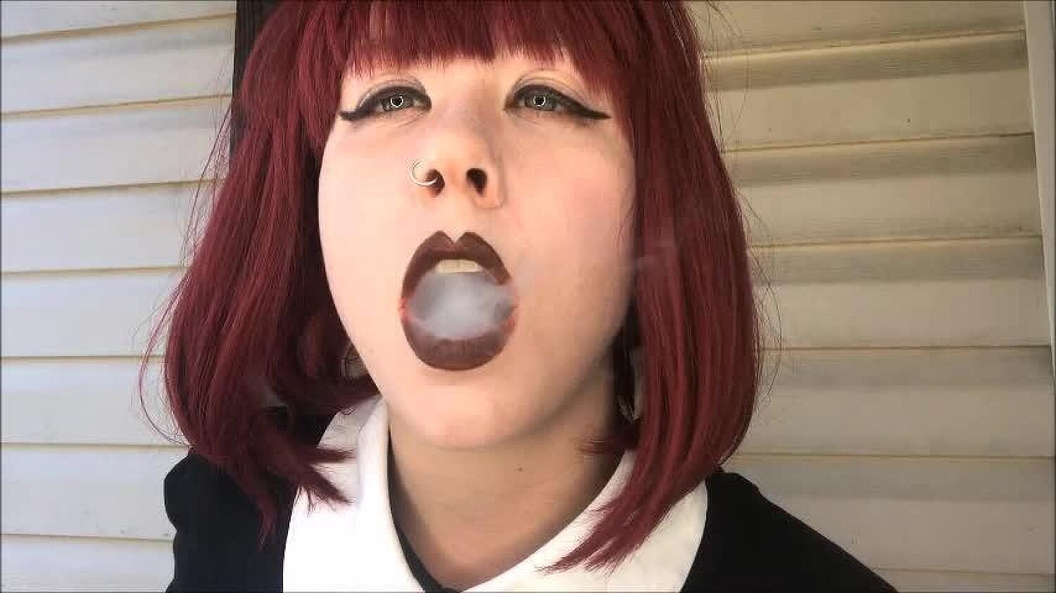 Redhead Smoking A Clove In Gloves