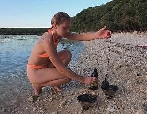 Hot Ginger Professional Fire Dancer Lea Playing with Her Flames on the Beach During Sunset