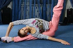 Olga With Legs Behind Her Neg