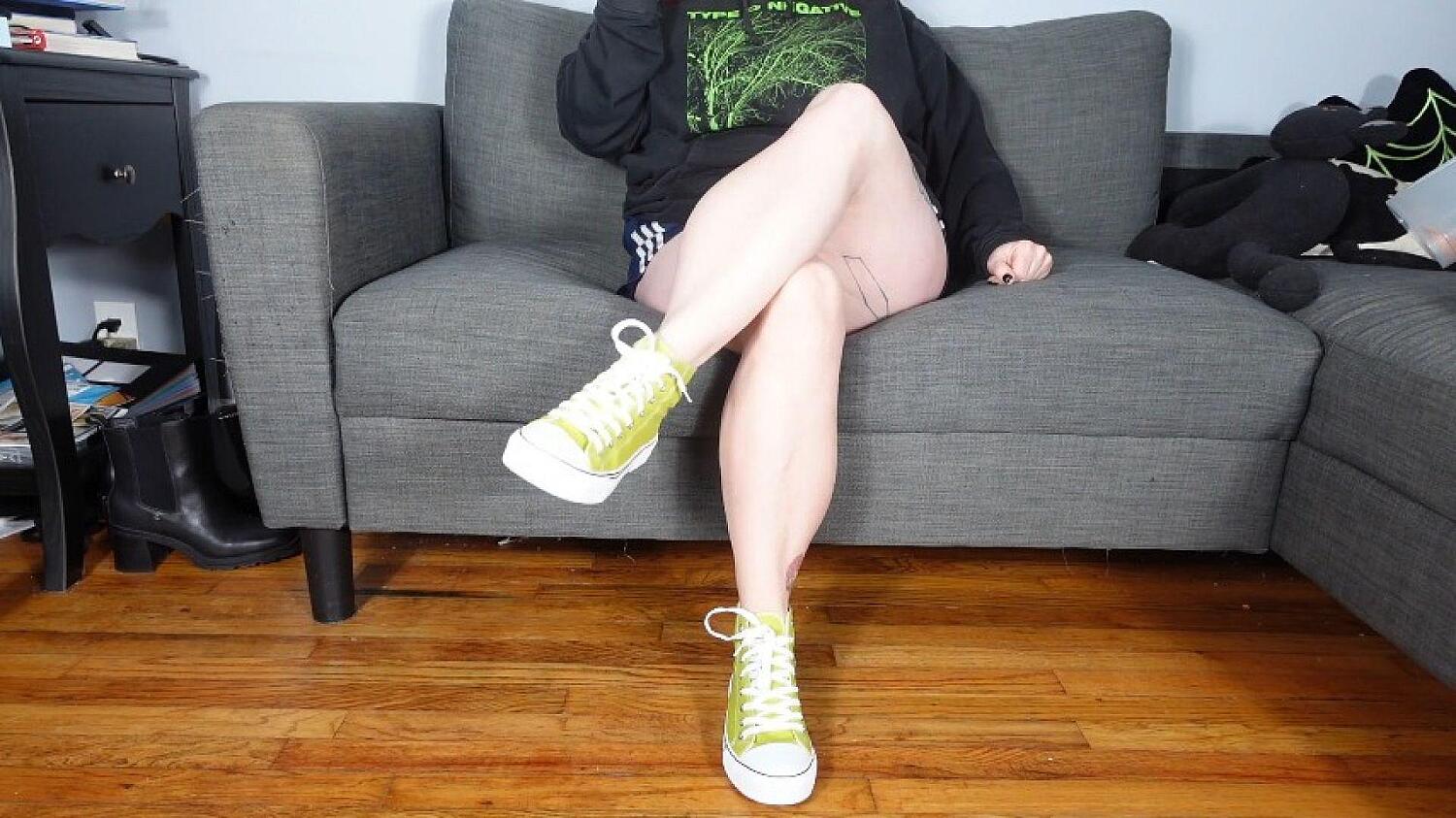 Crossed Legs In Lime Green Converse