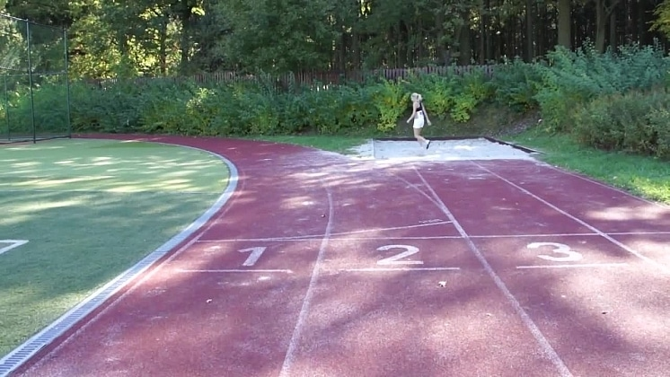 Kathy in the Locker Room Then on the Track Field