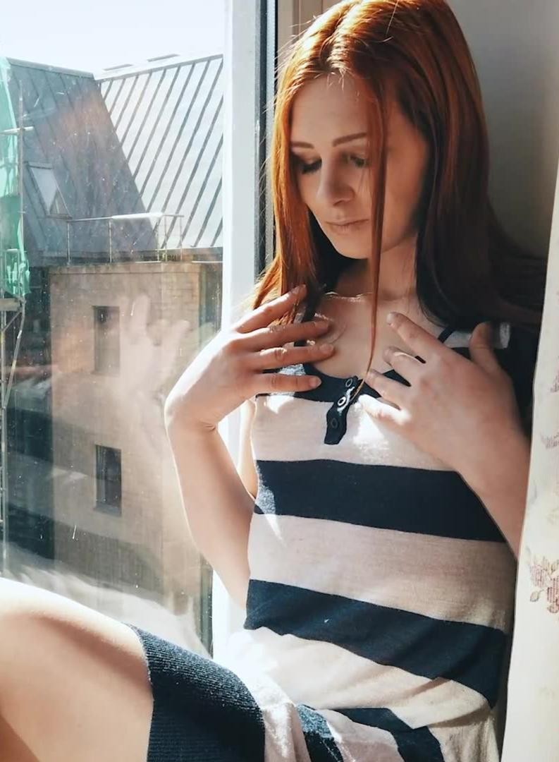 Lea in Sunshine Redhead Babe at the Window