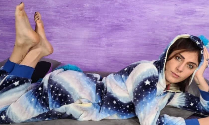 Stunning Aradia in a One-Piece Hooded Pajama and Purple Slippers