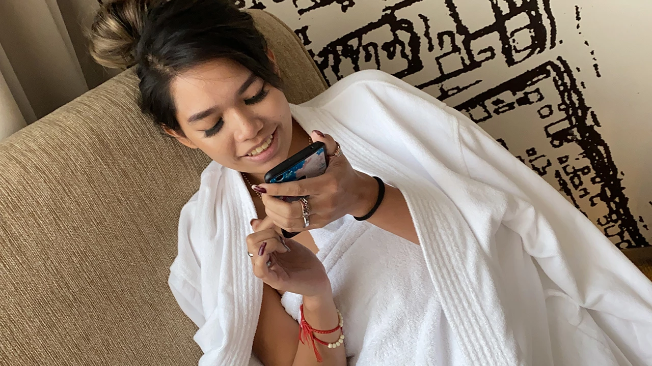 Cute Lazy Girl Lounging Around Hotel Room