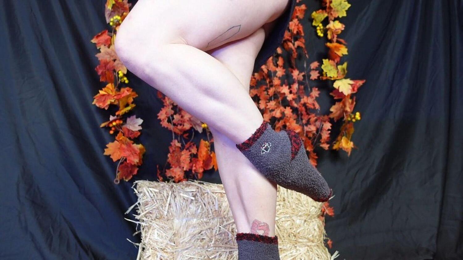 Grey Fuzzy Bat Socks And Muscular Calves Flexing