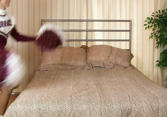 Felix Cheerleader on the Bed