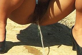 Woman Pissing on a Hill