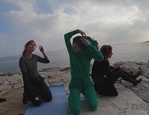 Naked Working Out on a Rocky Beach Cold January Day on Winter Vacation