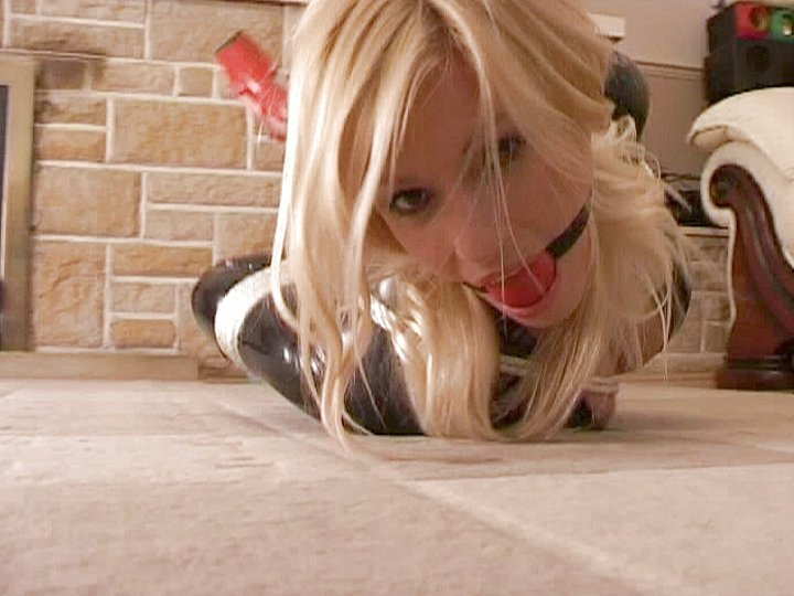 Fetish Scene of a Blonde Bound in Ropes and Wearing a Ball Gag