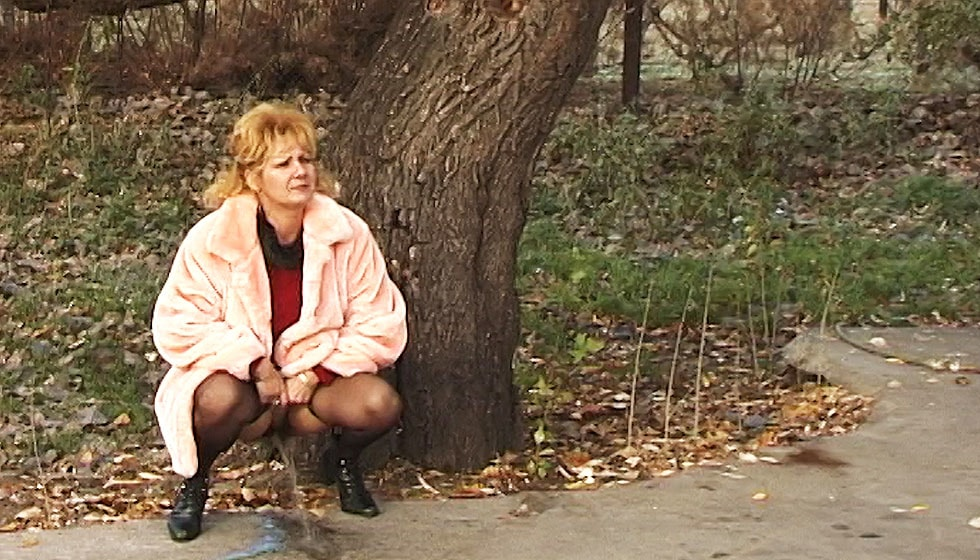 Mature Pissing Next to Tree