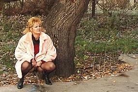 Mature Pissing Next to Tree