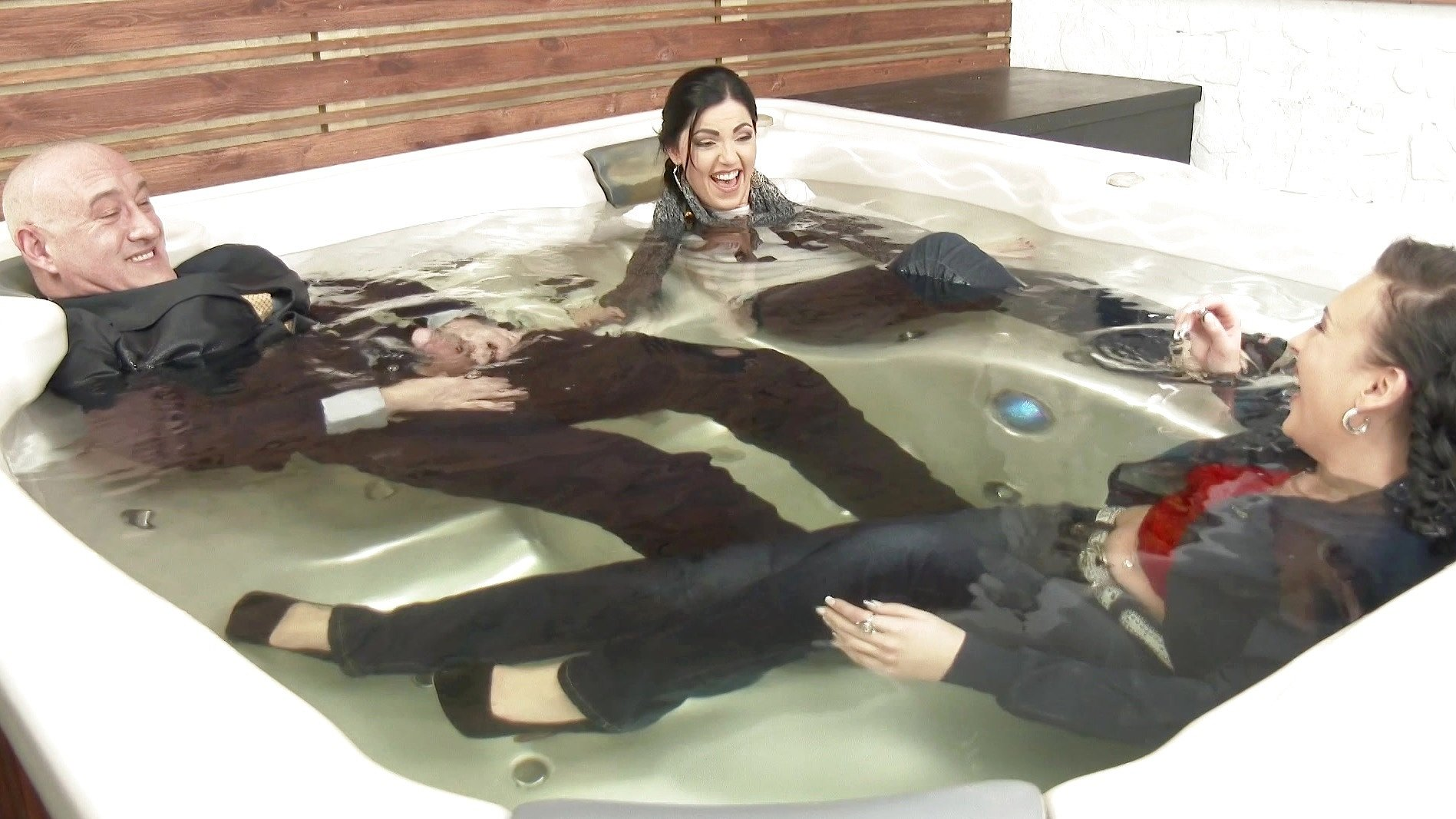 Two Brunette Babes and Their Boss Have Mostly Clothed Threesome